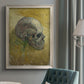 Profile skull study artwork by Vincent van Gogh in an {frame_style_descriptor} displayed in a neutral interior setting.