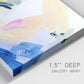 Close-up view of wrapped canvas corner featuring bright abstract candy colored strokes.
