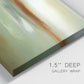 Close-up view of wrapped canvas corner featuring green focused abstract color vision.