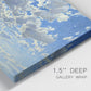Close-up view of wrapped canvas corner featuring whimsical cloud filled sky landscape.