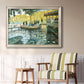 Impressionist riverside leisure scene by Claude Monet in an ornate champagne frame displayed in a light-toned interior setting.