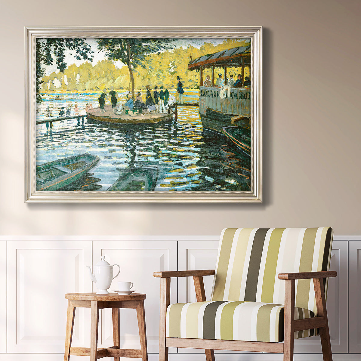 Impressionist riverside leisure scene by Claude Monet in an ornate champagne frame displayed in a light-toned interior setting.