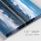 Close-up view of wrapped canvas corner featuring calm lake beneath mountains photograph.