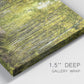 Close-up view of wrapped canvas corner featuring tree lined forest road photograph.