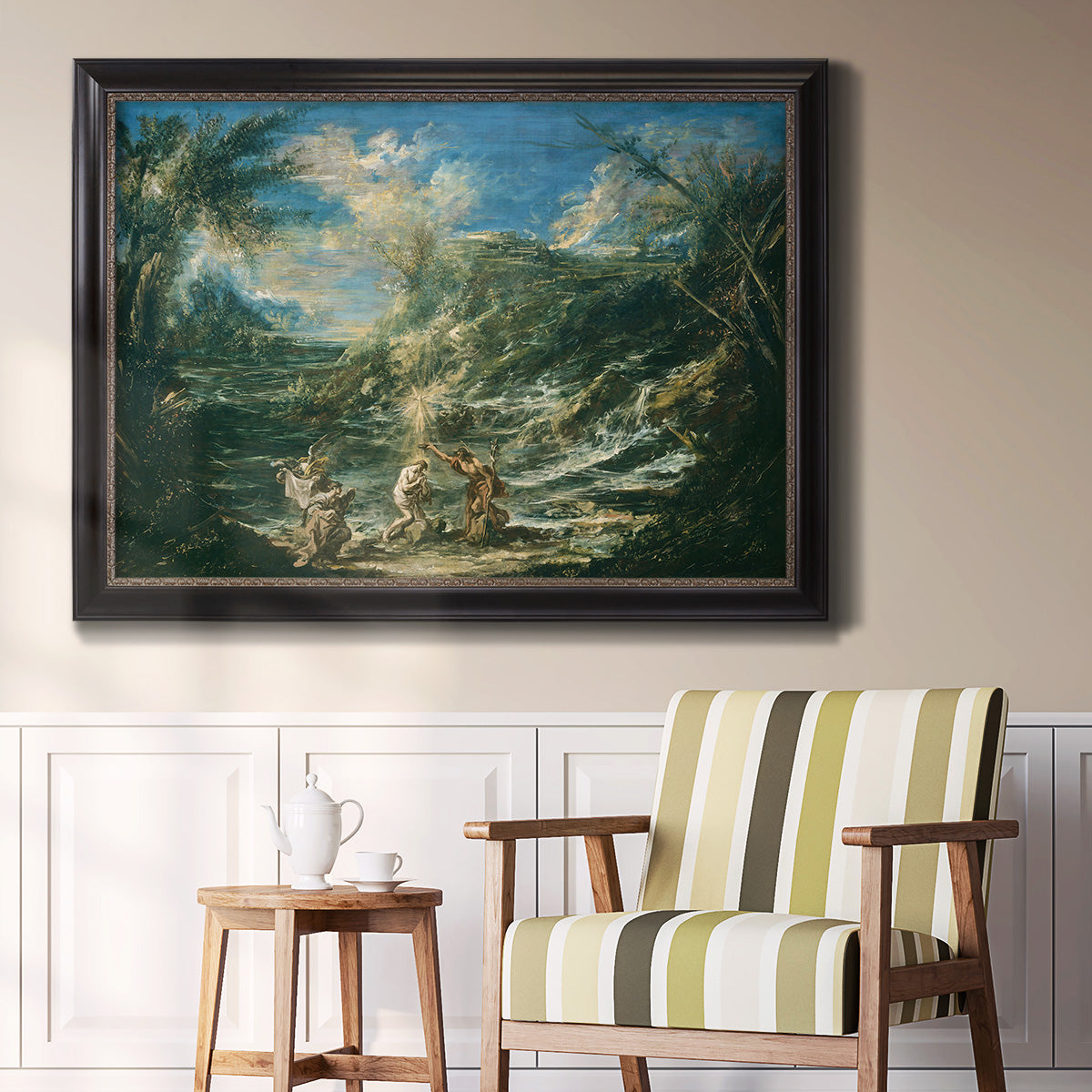 Religious landscape depicting the baptism of Christ by Alessandro Magnasco in an ornate black frame with gilded inner detail displayed in a light-toned interior setting.