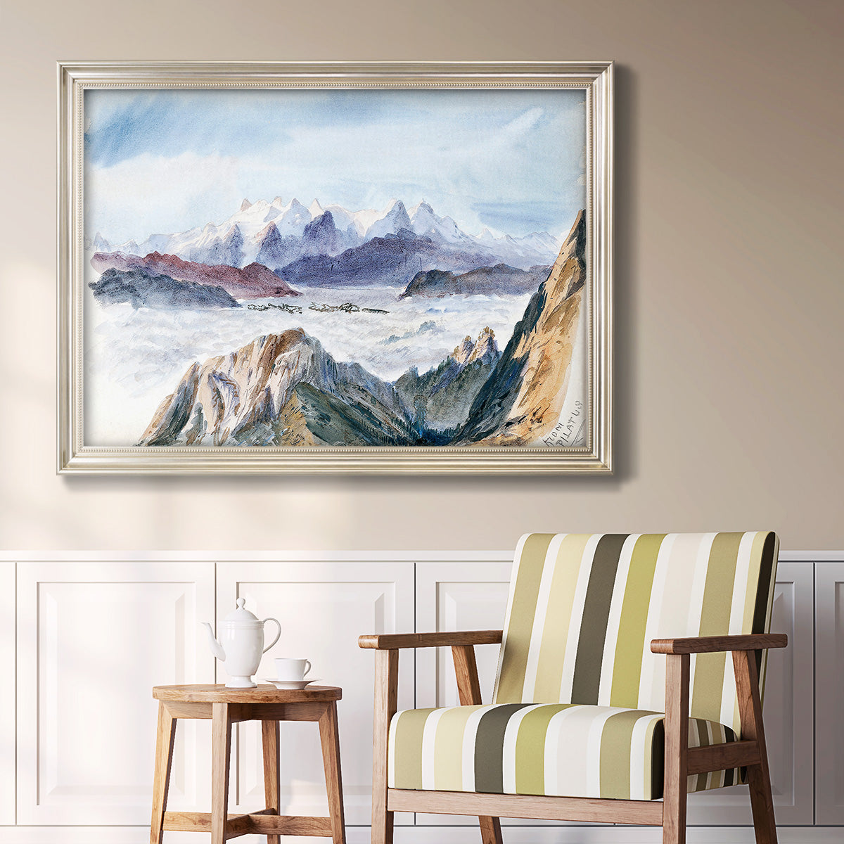 Impressionist alpine mountain landscape by John Singer Sargent in an ornate champagne frame displayed in a light-toned interior setting.
