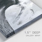 Close-up view of wrapped canvas corner featuring black and white crashing ocean waves.