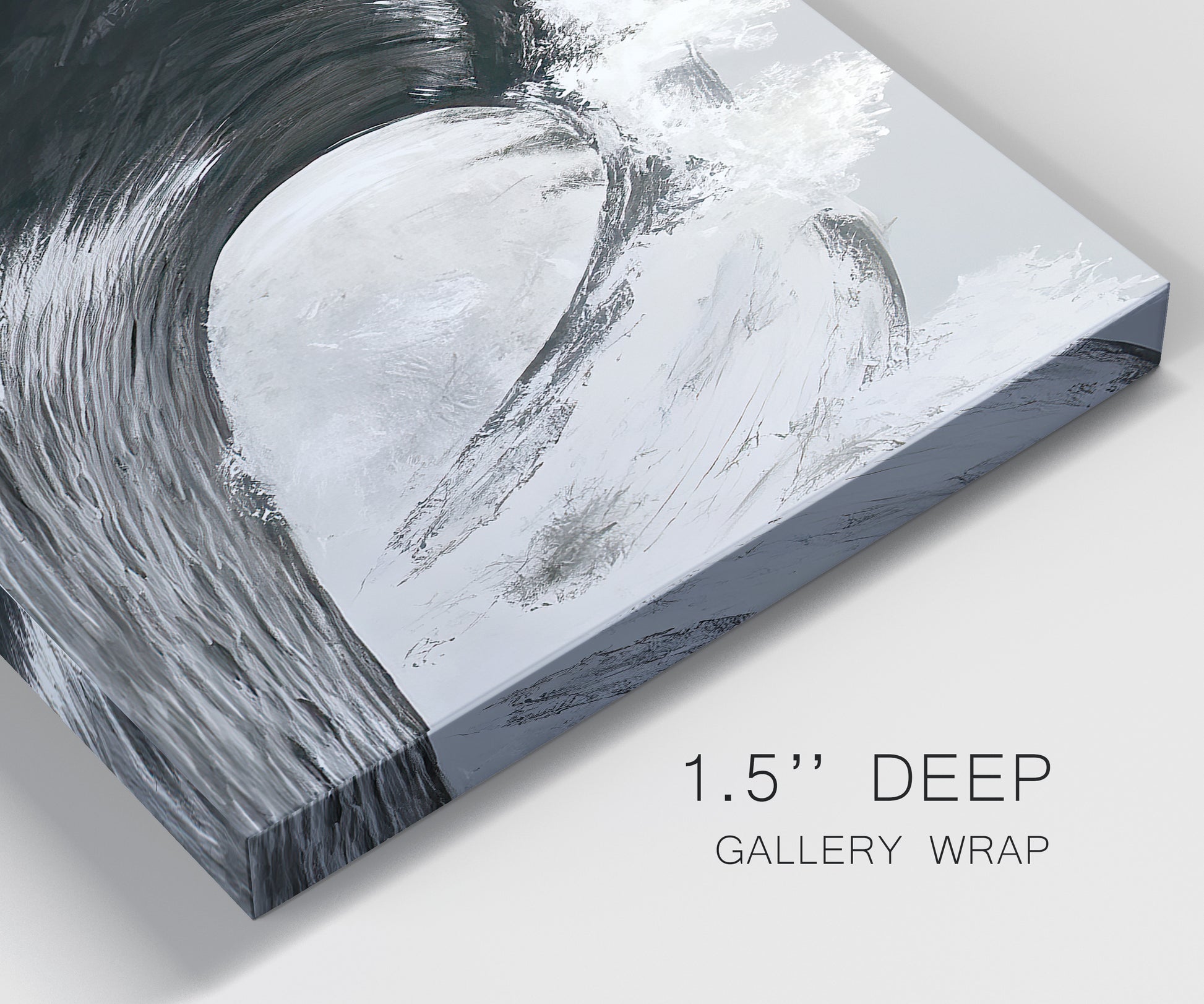 Close-up view of wrapped canvas corner featuring black and white crashing ocean waves.