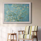 Impressionist flowering almond branch painting by Vincent van Gogh in an ornate weathered white frame displayed in a light-toned interior setting.