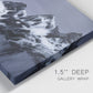 Close-up view of wrapped canvas corner featuring moonlit mountain peaks under night sky.