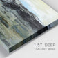 Close-up view of wrapped canvas corner featuring muted abstract landscape study.
