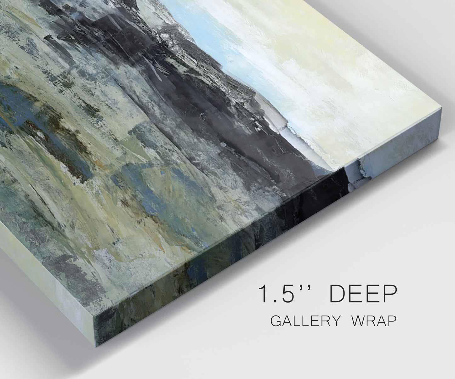 Close-up view of wrapped canvas corner featuring muted abstract landscape study.