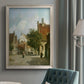 Rustic European street scene painting by Adriaan Eversen in an {frame_style_descriptor} displayed in a neutral interior setting.