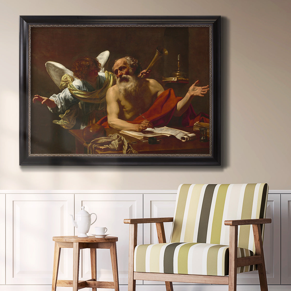 Classical religious painting of Saint Jerome with an angel by Simon Vouet in an ornate black frame with gilded inner detail displayed in a light-toned interior setting.