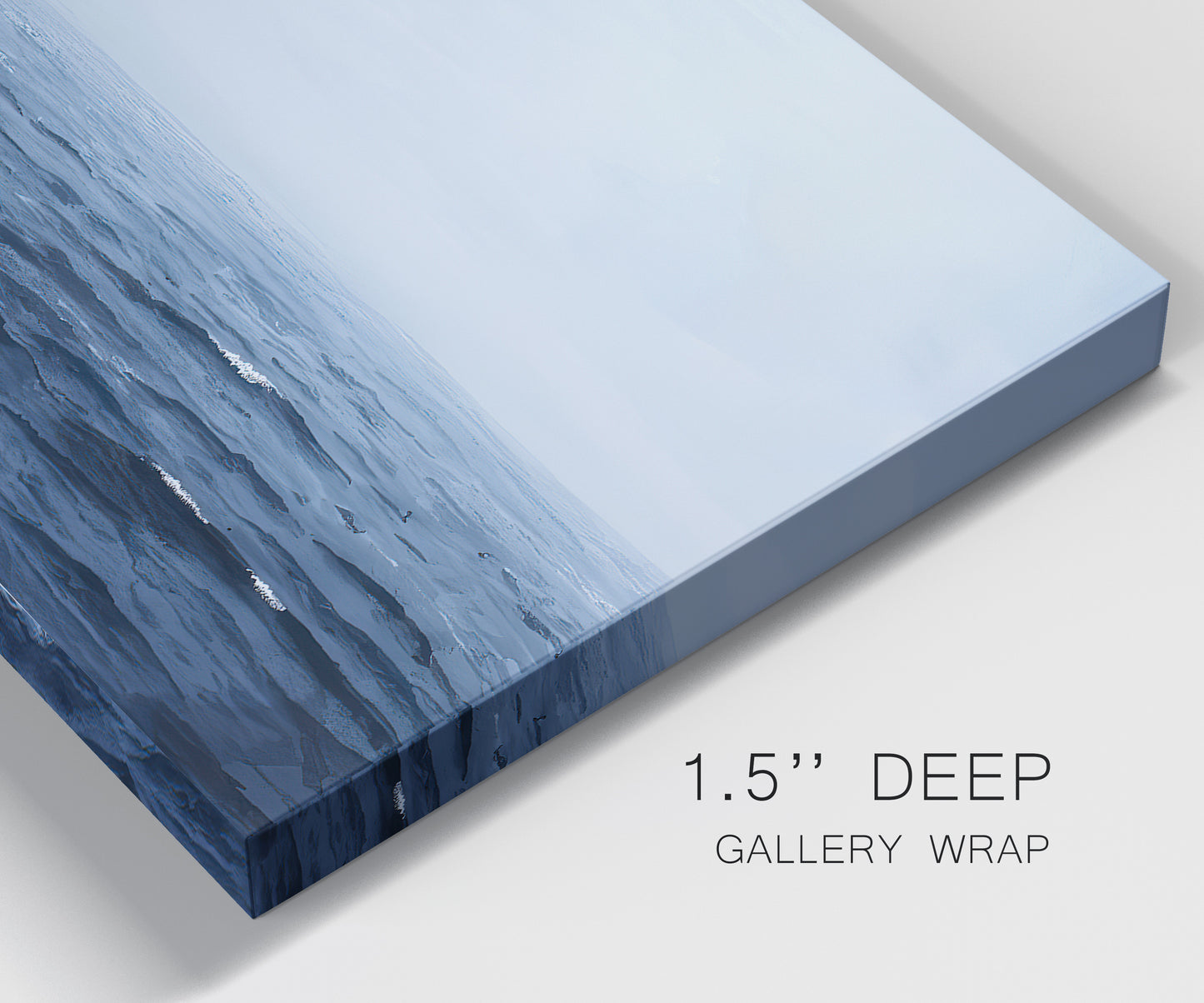 Close-up view of wrapped canvas corner featuring grayscale seascape with horizon.
