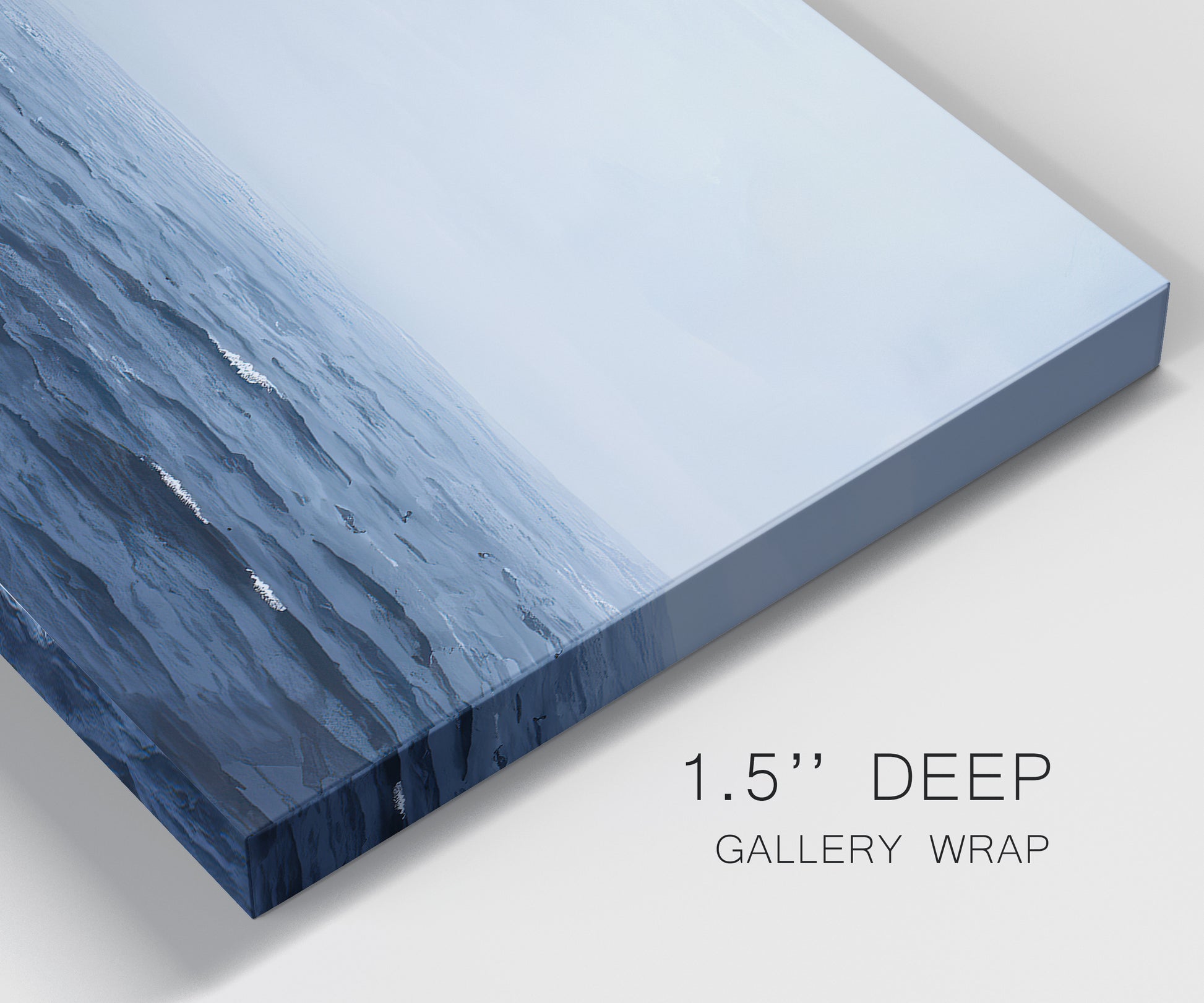 Close-up view of wrapped canvas corner featuring grayscale seascape with horizon.