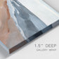 Close-up view of wrapped canvas corner featuring abstract coastal beach composition.
