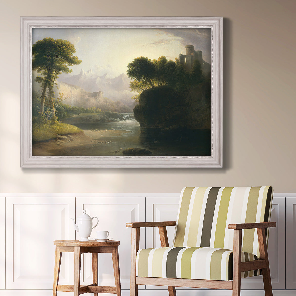 Romantic autumn landscape along the Hudson River by Thomas Doughty in an ornate weathered white frame displayed in a light-toned interior setting.