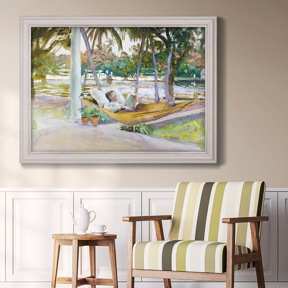 Impressionist leisure portrait scene by John Singer Sargent in an ornate weathered white frame displayed in a light-toned interior setting.
