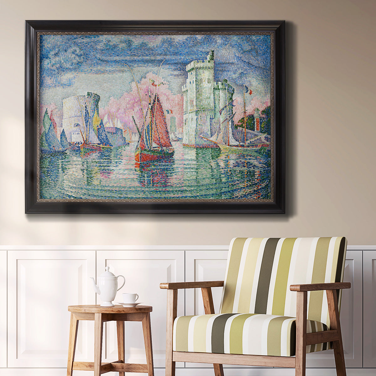 Impressionist harbor scene by Paul Signac in an ornate black frame with gilded inner detail displayed in a light-toned interior setting.