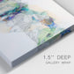 Close-up view of wrapped canvas corner featuring abstract mountain range watercolor.