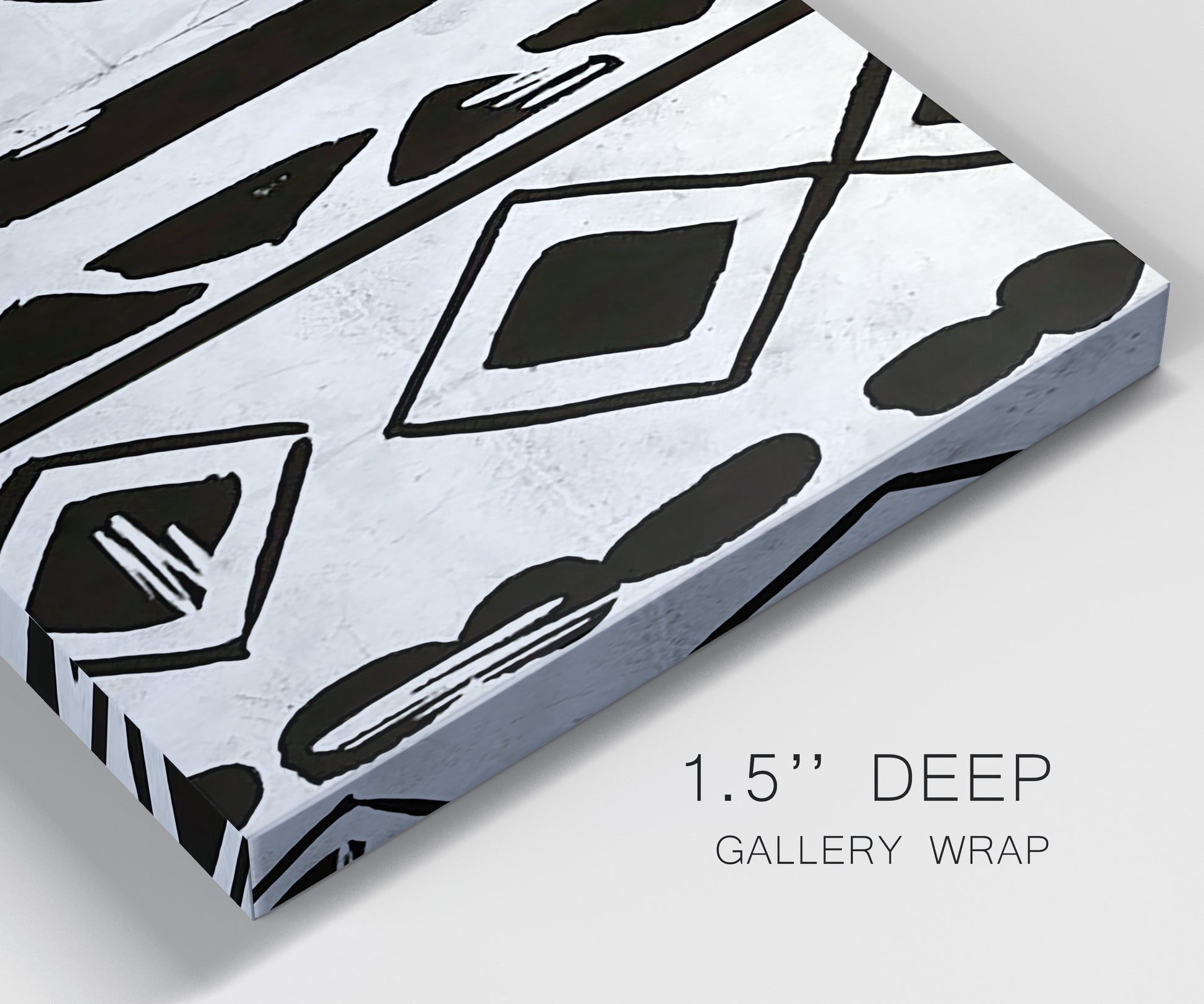 Close-up view of wrapped canvas corner featuring geometric abstract forms merging pattern.