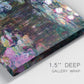 Close-up view of wrapped canvas corner featuring water lilies with willow reflections.