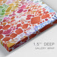 Close-up view of wrapped canvas corner featuring peaceful tropical inspired landscape.