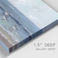 Close-up view of wrapped canvas corner featuring shore birds searching along beach.