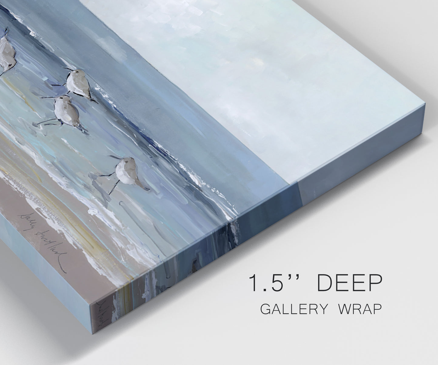 Close-up view of wrapped canvas corner featuring shore birds searching along beach.