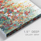 Close-up view of wrapped canvas corner featuring colorful garden flowers in bloom.