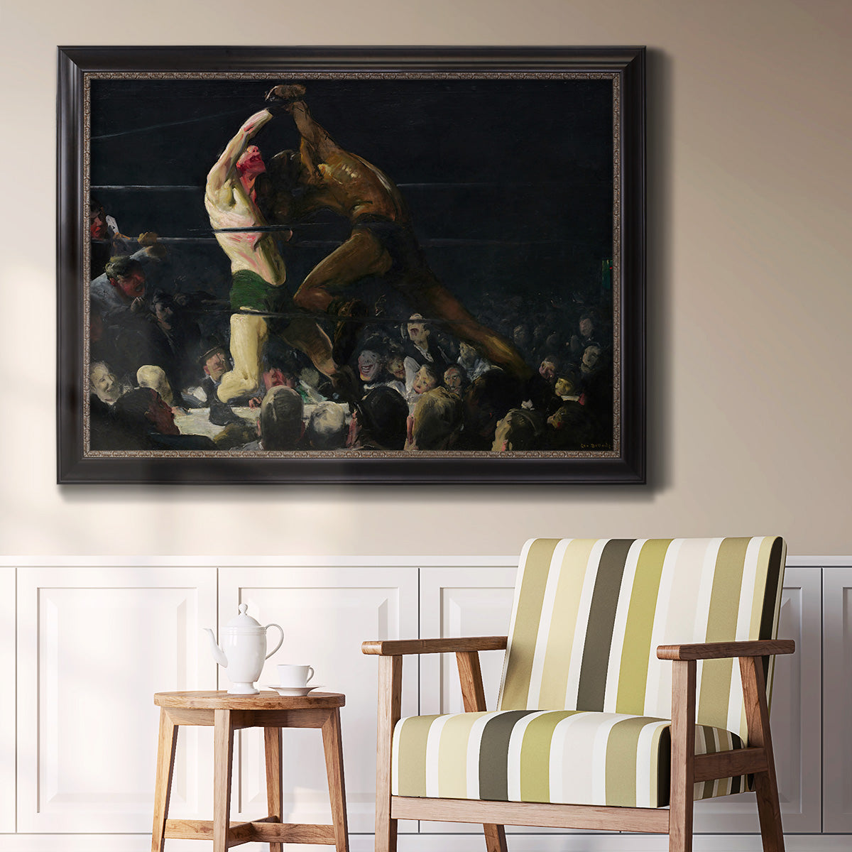 American genre painting of men in a social club by George Bellows in an ornate black frame with gilded inner detail displayed in a light-toned interior setting.