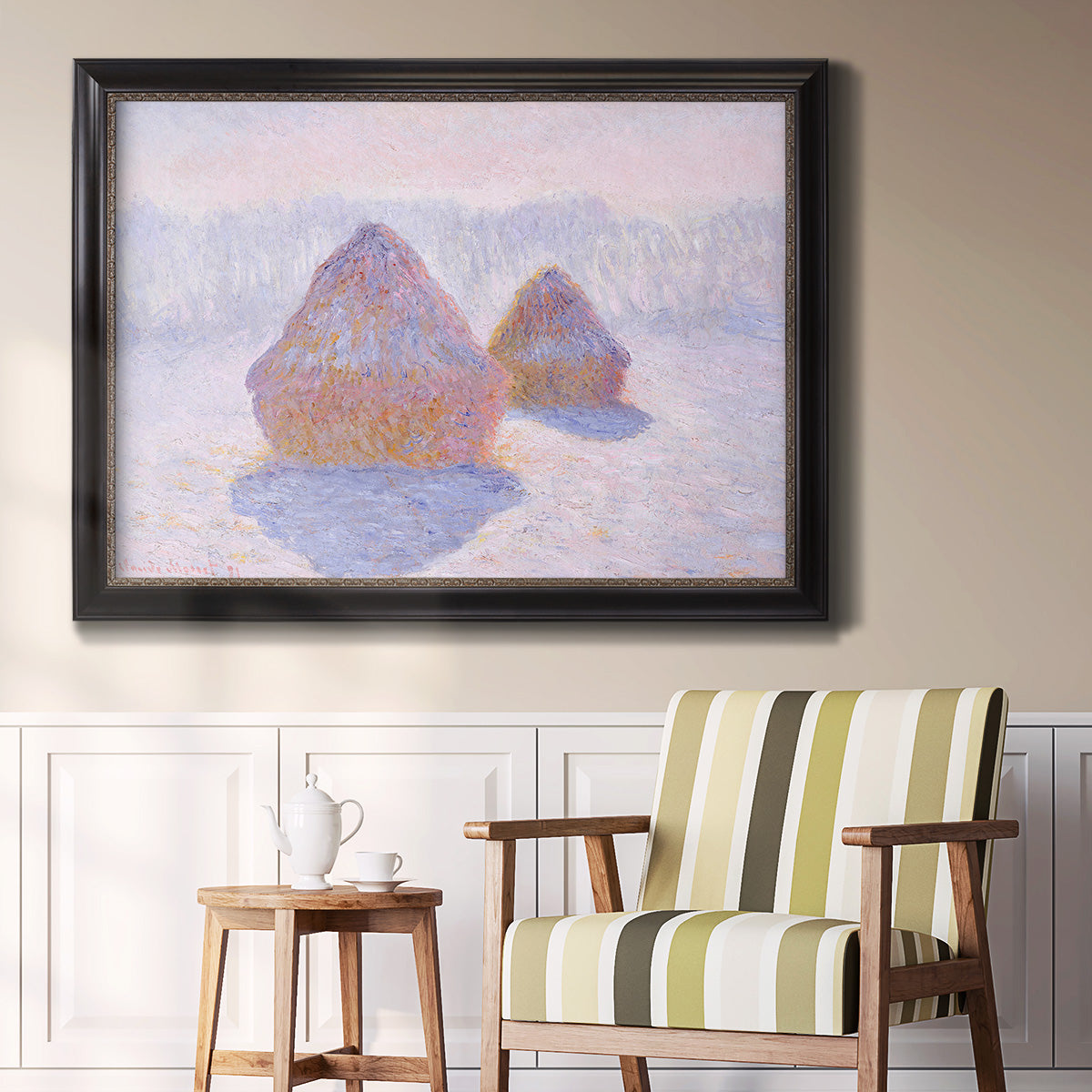 Impressionist winter haystack scene with sunlight by Claude Monet in an ornate black frame with gilded inner detail displayed in a light-toned interior setting.