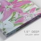 Close-up view of wrapped canvas corner featuring pink and white lilies in bloom.