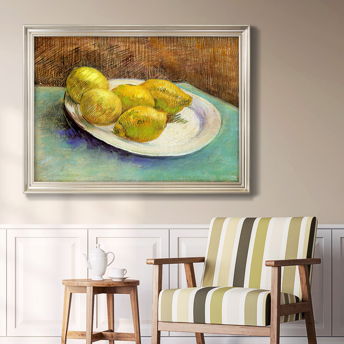 Impressionist still life with lemons by Vincent van Gogh in an ornate champagne frame displayed in a light-toned interior setting.