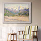 Impressionist valley landscape in southern France by Claude Monet in an ornate weathered white frame displayed in a light-toned interior setting.