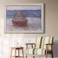 Impressionist single haystack landscape by Claude Monet in an ornate weathered white frame displayed in a light-toned interior setting.