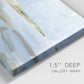 Close-up view of wrapped canvas corner featuring coastal cove with calm water.