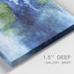 Close-up view of wrapped canvas corner featuring flowing blue abstract watercolor.