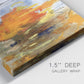 Close-up view of wrapped canvas corner featuring abstract warm sunset tones.