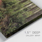 Close-up view of wrapped canvas corner featuring forest trail landscape photograph.