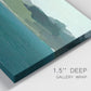 Close-up view of wrapped canvas corner featuring calm lake water under open sky.