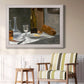 Impressionist still life with wine and bread by Claude Monet in an ornate weathered white frame displayed in a light-toned interior setting.