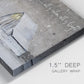 Close-up view of wrapped canvas corner featuring rustic winter holiday text art.