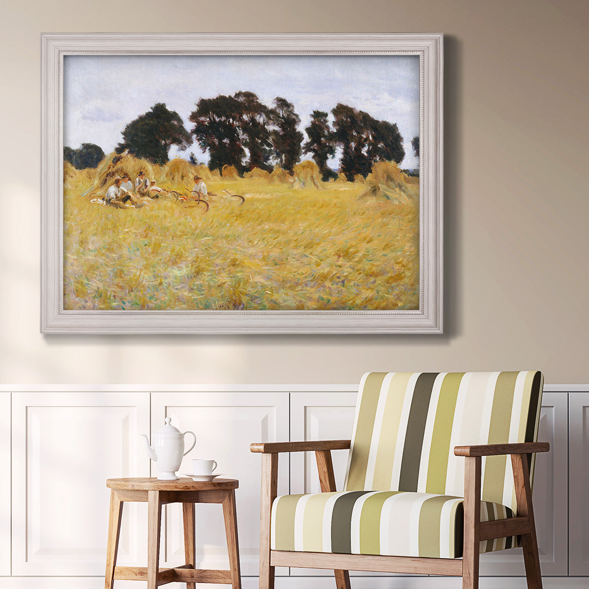 Impressionist rural harvest scene by John Singer Sargent in an ornate weathered white frame displayed in a light-toned interior setting.