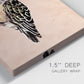 Close-up view of wrapped canvas corner featuring coastal bird illustration.