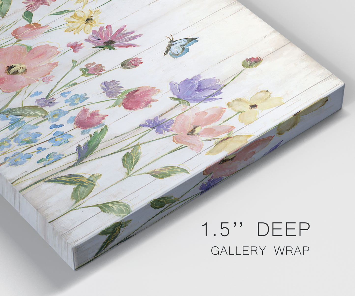 Close-up view of wrapped canvas corner featuring delicate wildflower illustration.
