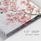 Close-up view of wrapped canvas corner featuring blooming cherry blossom branches.
