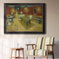 Impressionist interior of a night café by Vincent van Gogh in an ornate black frame with gilded inner detail displayed in a light-toned interior setting.