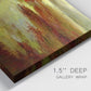 Close-up view of wrapped canvas corner featuring coastal shoreline with warm light.